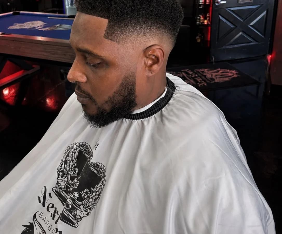 Textured haircut detail by Adan Flores at Next Level Barbershop in Orange, California.