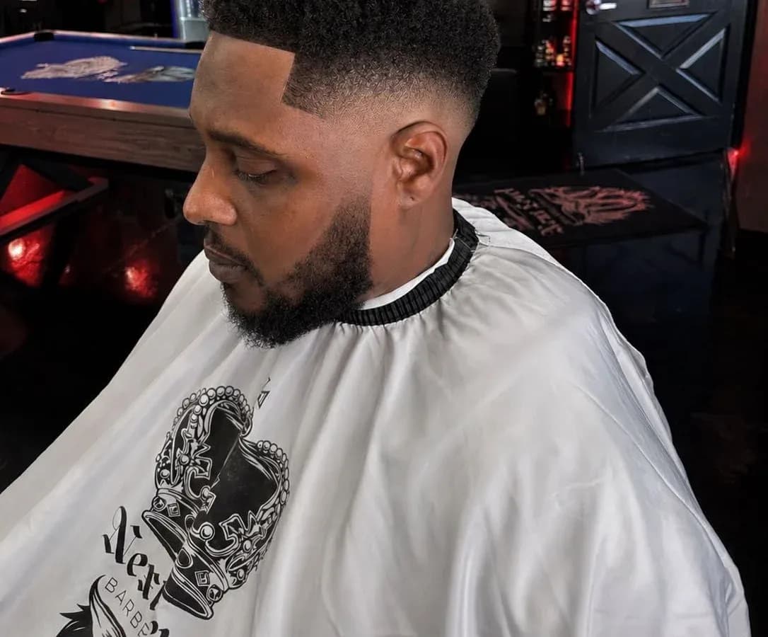 Textured haircut detail by Adan Flores at Next Level Barbershop in Orange, California.