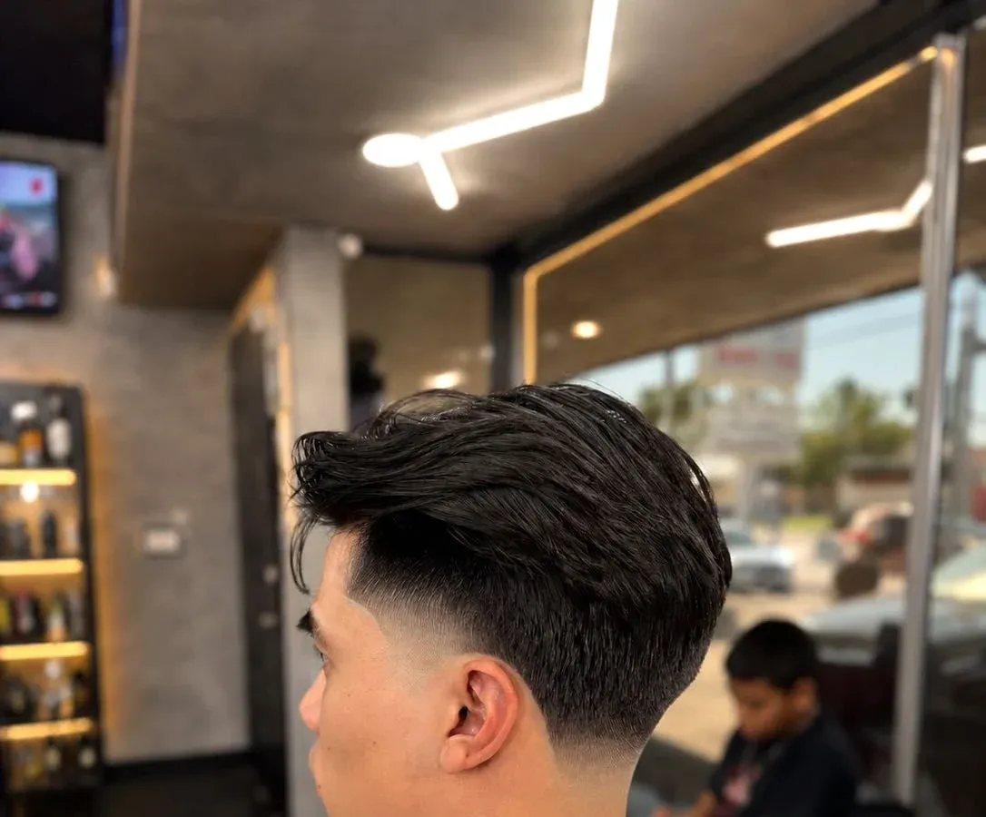 Side-profile haircut detail by Adan Flores at Next Level Barbershop in Orange, California.